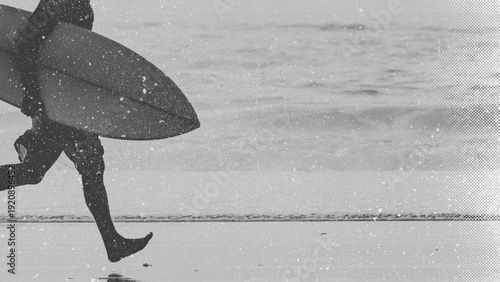 Black and white photo of professional surfer. Surfer Holding Surf Board Background.