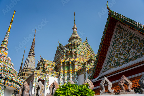 Fotografija Intricate Thai temple architecture and spires with porcelain mosaics at Wat Pho