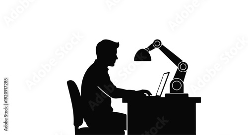 Man working on laptop with robotic arm lamp