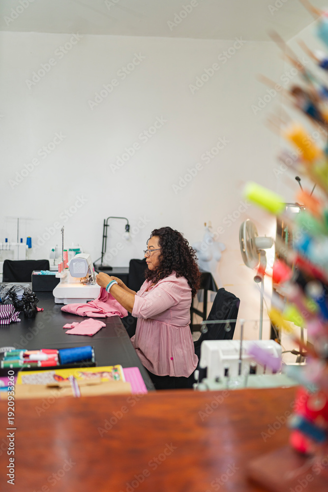 © Leonardo Borges/Stocksy - Seamstress working in her workshop © Leonardo Borges/Stocksy - Seamstress working in her workshop