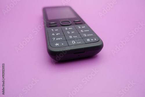 Feature Phone Keypad Detail Isolated on Purple Surface