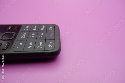 Feature Phone Keypad Detail Isolated on Purple Surface