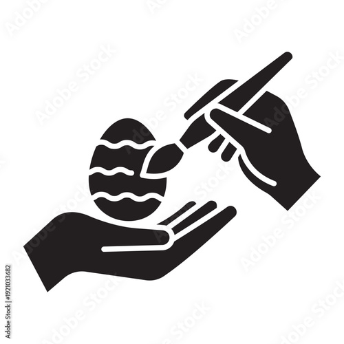 Easter egg painting solid icon. Black silhouette of hands with brush and patterned egg. Minimalist holiday craft symbol. Professional vector graphics for Easter celebration and DIY art.