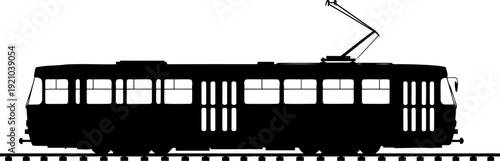 Electric tram silhouette moving on urban city tracks