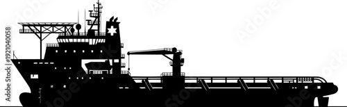 Offshore supply vessel silhouette navigating through open water