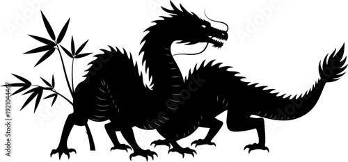 Chinese dragon figure posing near bamboo stalks