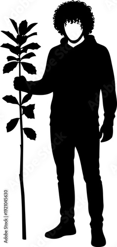 Man holding tall sapling plant silhouette
