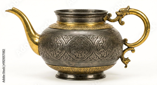 Antique Ornate Metal Ewer with Brass Accents and Engraved Floral Pattern Isolated on White Background