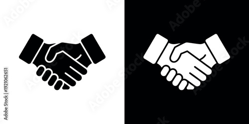 Black and white handshake on split background business 1