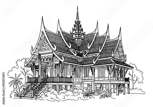 Traditional Thai house with intricate architecture and gardens