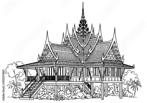 Traditional Khmer house with intricate roof design in tropical setting