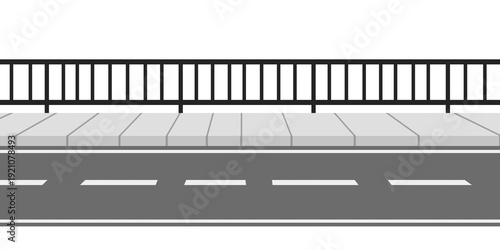 Empty city sidewalk and asphalt road with black metal safety railing