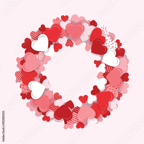 A heart-shaped wreath, formed by layered hearts in pink and red hues