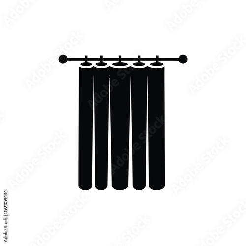 A simple black curtain with five panels hanging from a rod.