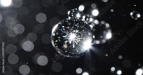 Wallpaper Mural Close-up of shimmering water droplets suspended in the air against a dark background Torontodigital.ca