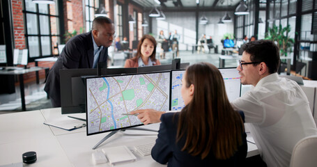 Real Estate Agent Surveying Land Using Cadastre Map