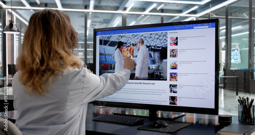 Foto Woman Watching News On Laptop And Mobile Phone