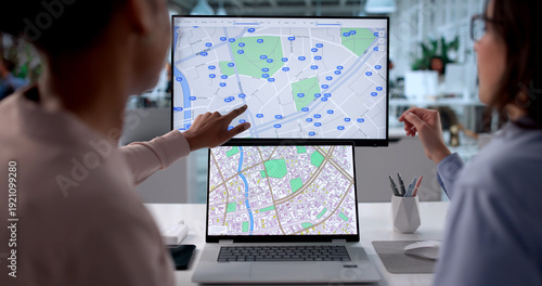Принти на полотні Young Black Woman Using Computer To Map Real Estate Properties
