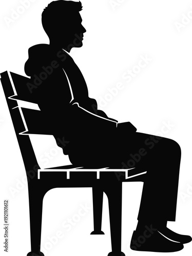 Silhouette of a man sitting on a chair in a relaxed pose