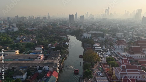 Aerial view morning sunrise with fog river rural village with modern office building background Bangkok Thailand