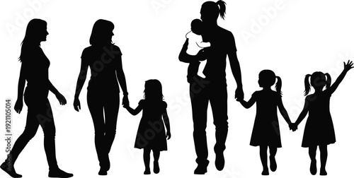 Silhouette of a happy multi-generational family walking together outdoors with parents holding hands with children and carrying a small baby