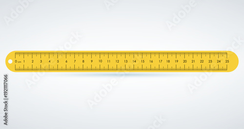 A yellow ruler with black numbers and markings on a white background