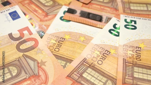 sliding shot of fifty euro banknotes closeup
