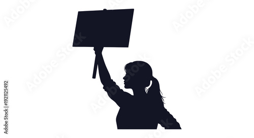 A striking black silhouette of a woman holding a blank sign aloft representing protest or advocacy silhouette