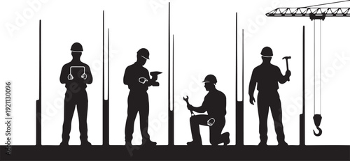 Construction workers in silhouette with tools and crane