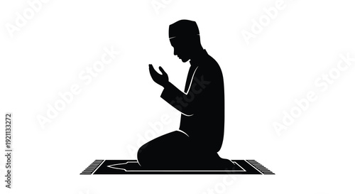 A devout muslim man is kneeling in prayer on a rug depicted as a striking black silhouette