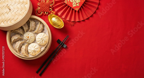 Tableau sur toile Steamed dumplings in bamboo steamer with chopsticks and red chinese new year dec