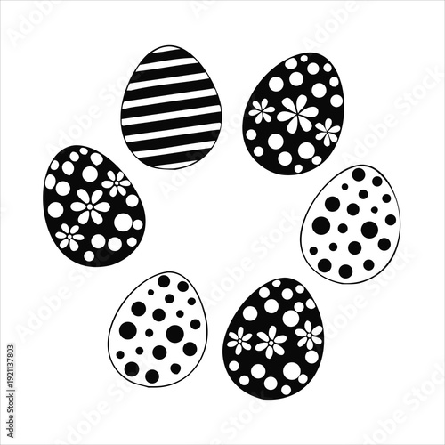 A collection of six black and white easter eggs arranged in a