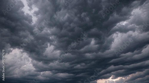 Dramatic, dark, and ominous storm clouds gathering in the sky, creating a sense of impending weather.