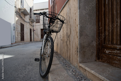 The old bicycle on a street.