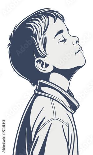 Young boy with eyes closed looking up in peaceful contemplation.