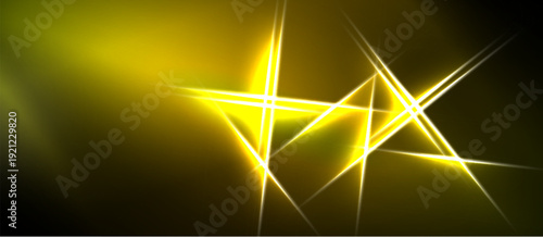 Abstract golden lines intersect dark background. Bright glow emanates from central point, creating dynamic visual effect.