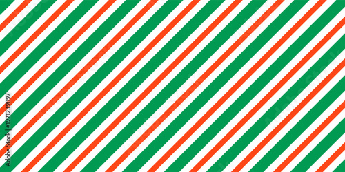 Christmas seamless pattern. Red and green diagonal stripes background. Candy cane repeating decoration wallpaper. Winter holiday lines backdrop. vector