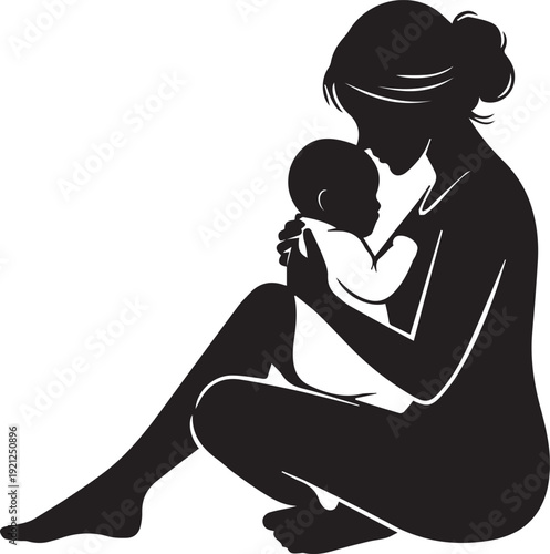 Silhouette of a mother breastfeeding her baby