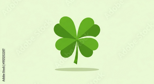 Lucky green four leaf clover on pastel background with shadow symbolizing good fortune and nature