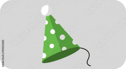 Green party hat with white polka dots and pom pom on light gray background for celebrations