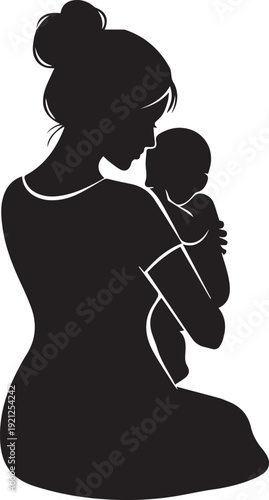 Silhouette of a mother holding and kissing her baby