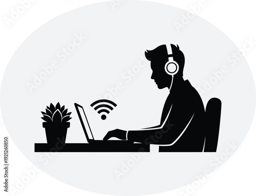 Man working on laptop with headphones and wi fi connection