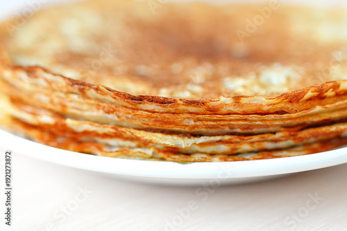 A stack of pancakes, a traditional Russian dish. Maslenitsa