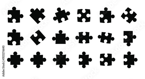 Collection of black puzzle pieces displayed as a striking silhouette