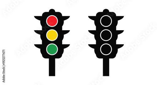 Traffic lights displaying red yellow and green a dark silhouette