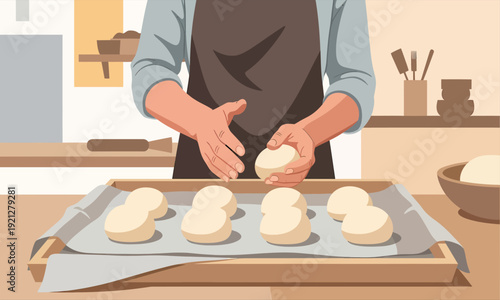 Baker shaping dough balls on a tray