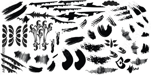 Collection of various black brush strokes and marks on white background