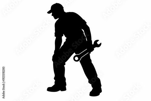 Mechanic Holding Wrench in Working Stance Silhouette