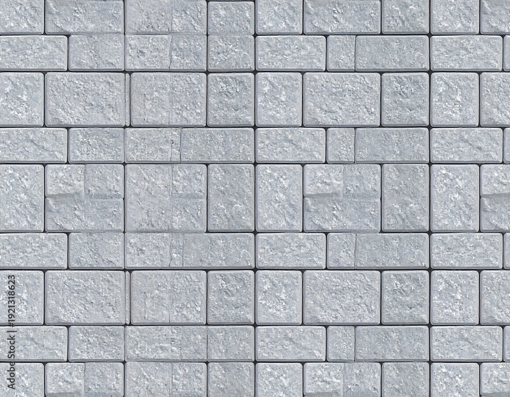 Fototapeta premium Light gray, rectangular stone tiles arranged in a repeating pattern