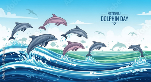 Dolphins jumping out of ocean waves on national dolphin day with blue sky and clouds